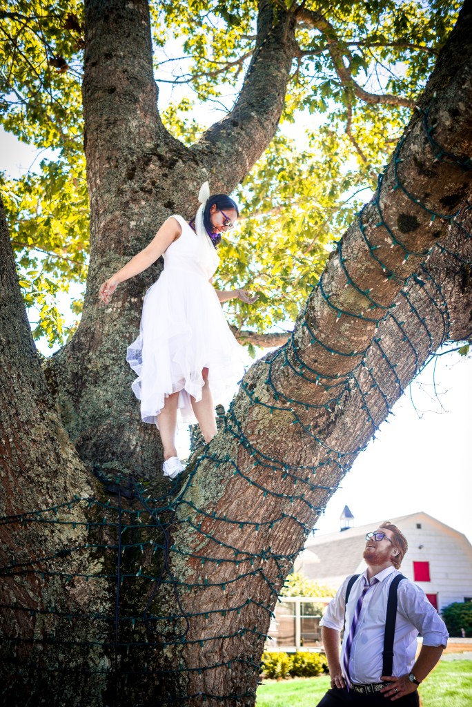 Sindy and Andrew sharing a playful moment outdoors at their farm wedding in Kentville, Nova Scotia