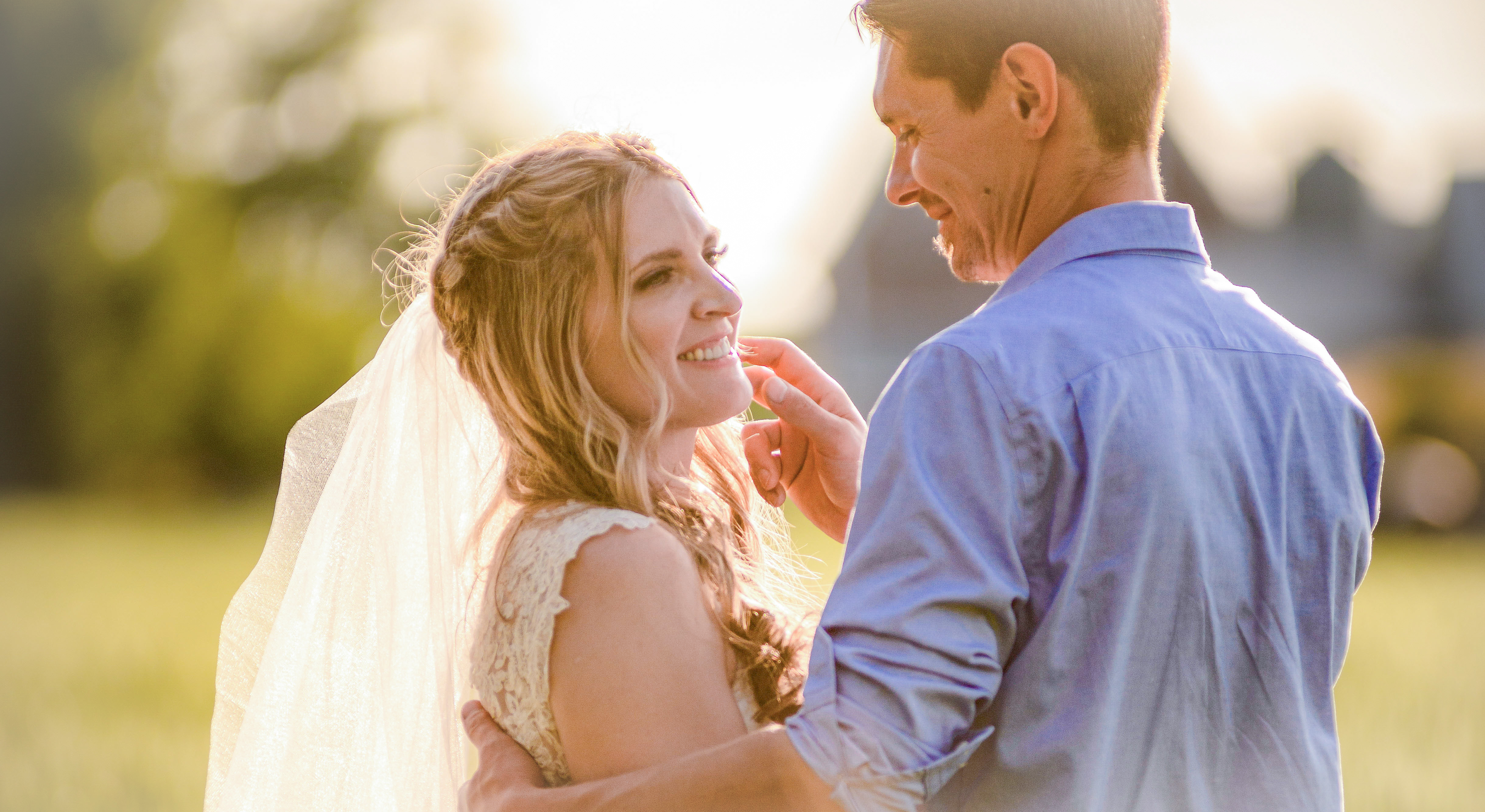 Wedding couple embracing outdoors at sunset in Nova Scotia